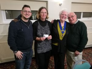 Image: club members receiving badges